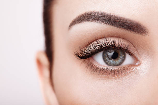 Close-up of eye with expertly applied makeup, highlighting techniques for enhancing natural eye shape.